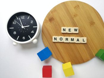 High angle view of clock on table