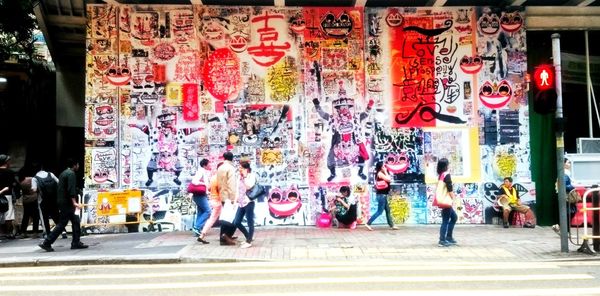 Group of people walking on city street