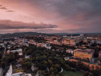 High angle shot of townscape against sky at sunset