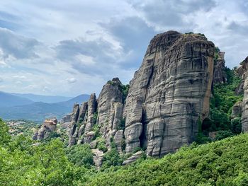 Low angle view of rock formations against sky