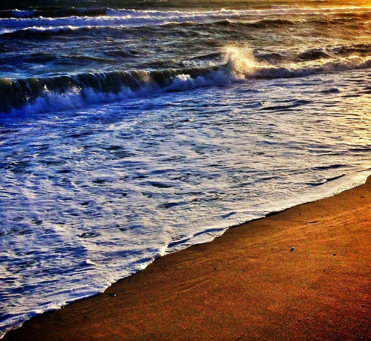 water, sea, wave, surf, beach, shore, beauty in nature, scenics, nature, tranquility, tranquil scene, motion, coastline, high angle view, sand, idyllic, rippled, outdoors, rock - object, no people