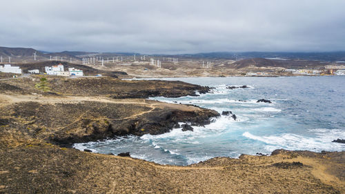 Scenic view of sea against cloudy sky