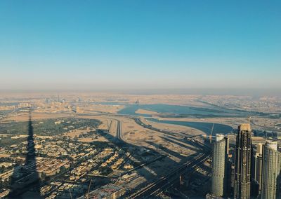 High angle view of buildings in city against clear sky