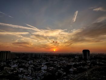 High angle view of buildings against sky during sunset