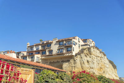 Low angle view of building against clear blue sky