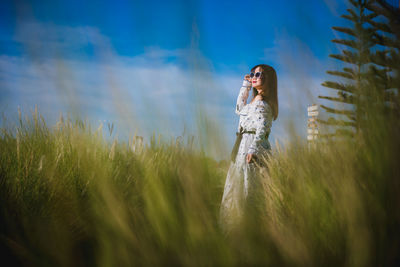 Woman standing on field