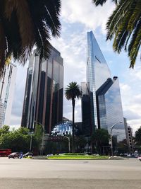 Modern buildings in city against sky