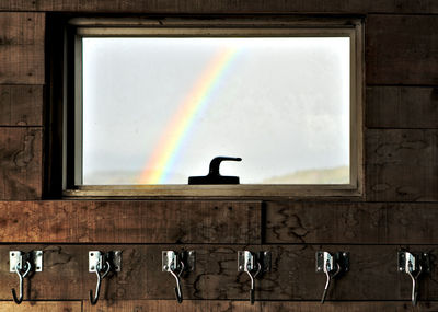 Low angle view of rainbow on wall