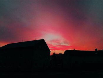 Silhouette of built structure at sunset