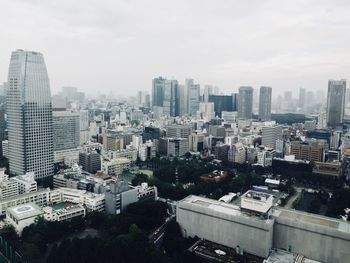 High angle view of modern buildings in city against sky