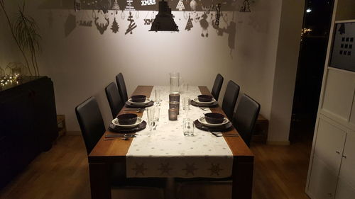 Empty tables and chairs at restaurant