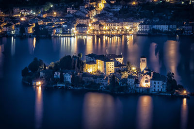 High angle view of illuminated isola san giulio at night