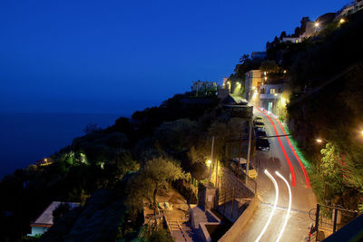 High angle view of light trails on road at night