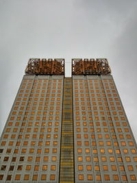 Low angle view of skyscraper against sky