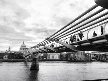 View of bridge over river against cloudy sky