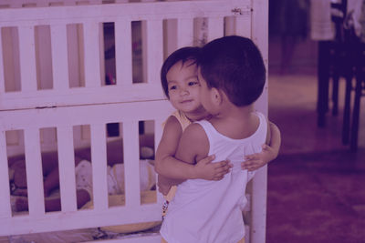 Boy with sister at home