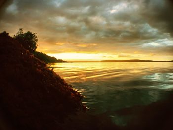 Scenic view of sea against cloudy sky