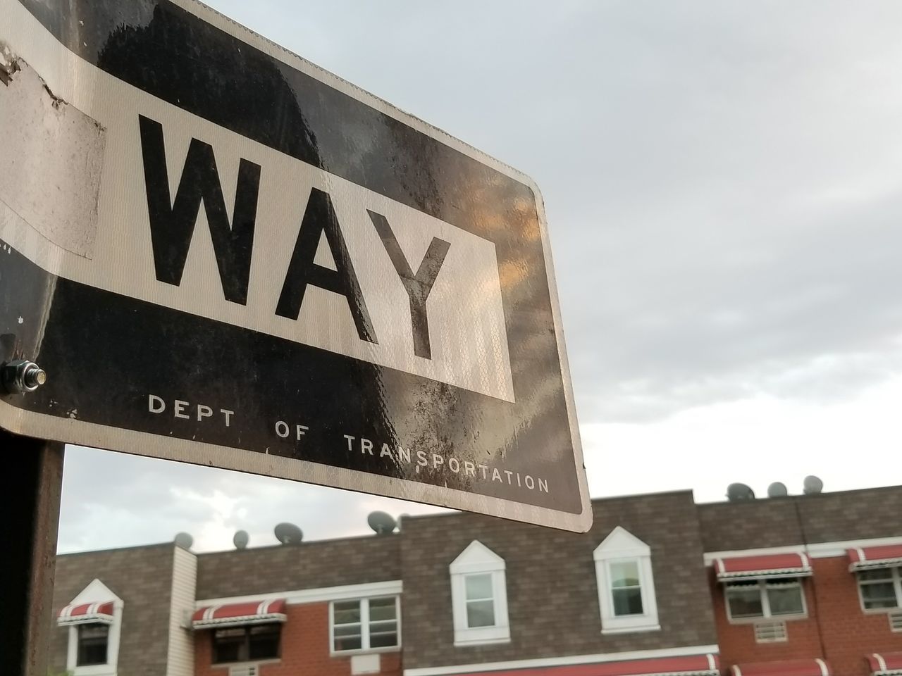 LOW ANGLE VIEW OF ROAD SIGNS AGAINST SKY