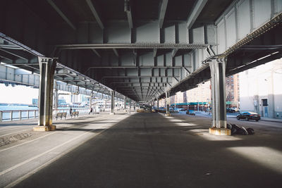 Walkway below elevated road in manhattan