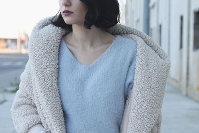 Midsection of woman wearing warm clothing during winter