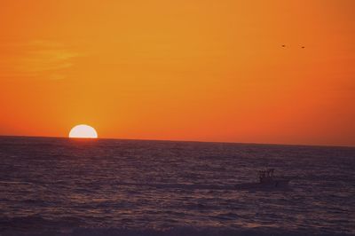 Scenic view of sea at sunset