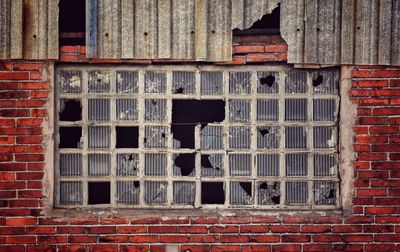 Old building against brick wall