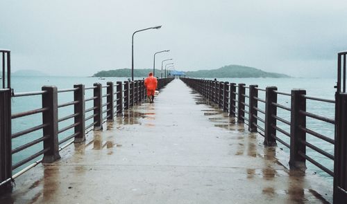 Pier over sea against sky