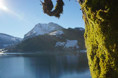 Scenic view of lake and mountains against sky