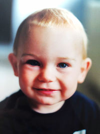 Close-up portrait of smiling boy