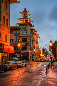 View of city street against sky at night