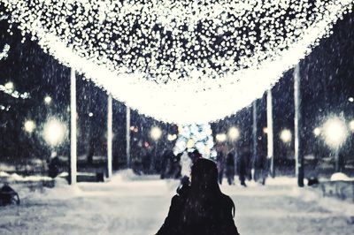 Snow covered street in city