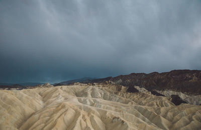 Scenic view of arid landscape against sky