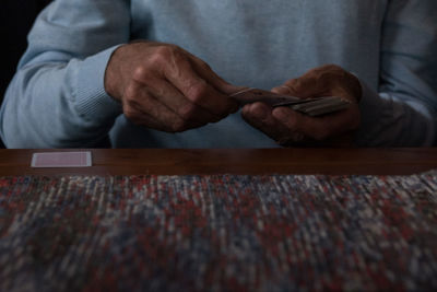 Close-up of hands with playing cards