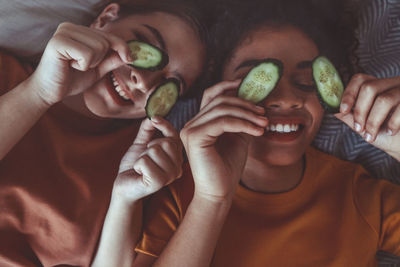 Cropped hand of woman holding fruit