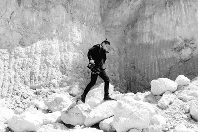 Full length of man standing on rock