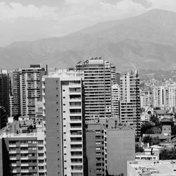 High angle view of buildings in city against sky