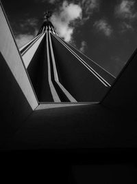 Low angle view of building against cloudy sky