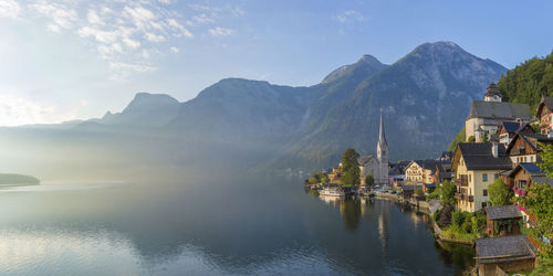 Scenic view of hallstatt village against mountains against sky