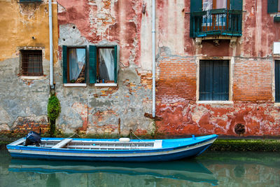 Boat in old building by canal