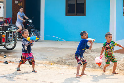 Full length of children playing at market