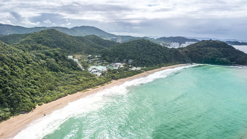 Aerial view of sea against mountain range