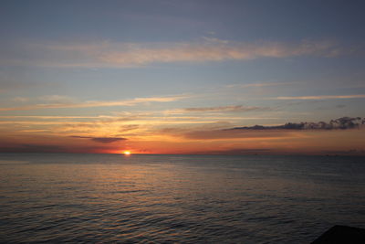 Scenic view of sea at sunset