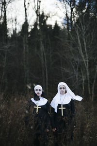 Two women dressed as nuns for halloween