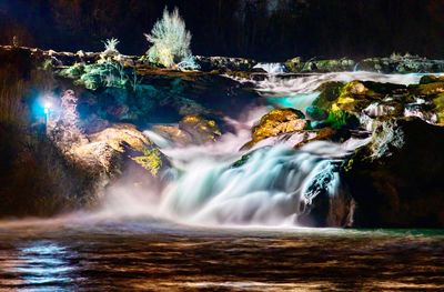 Scenic view of waterfall in forest