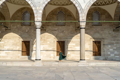 Woman in green dress exploring istanbul on vacation