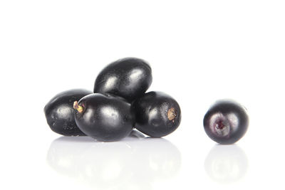 Close-up of blueberries against white background