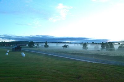 Scenic view of landscape against cloudy sky