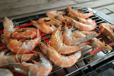 High angle view of meat on barbecue grill