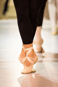 Low section of woman practicing ballet