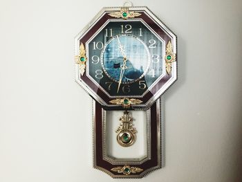 Close-up of clock against white background